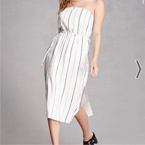 Lush strapless white dress with black vertical stripes and ties around waist.